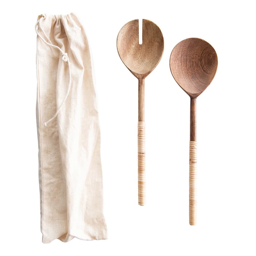 Creative Co-Op Salad Servers with Wrapped Handles, two wooden servers with rattan-wrapped handles and a linen bag