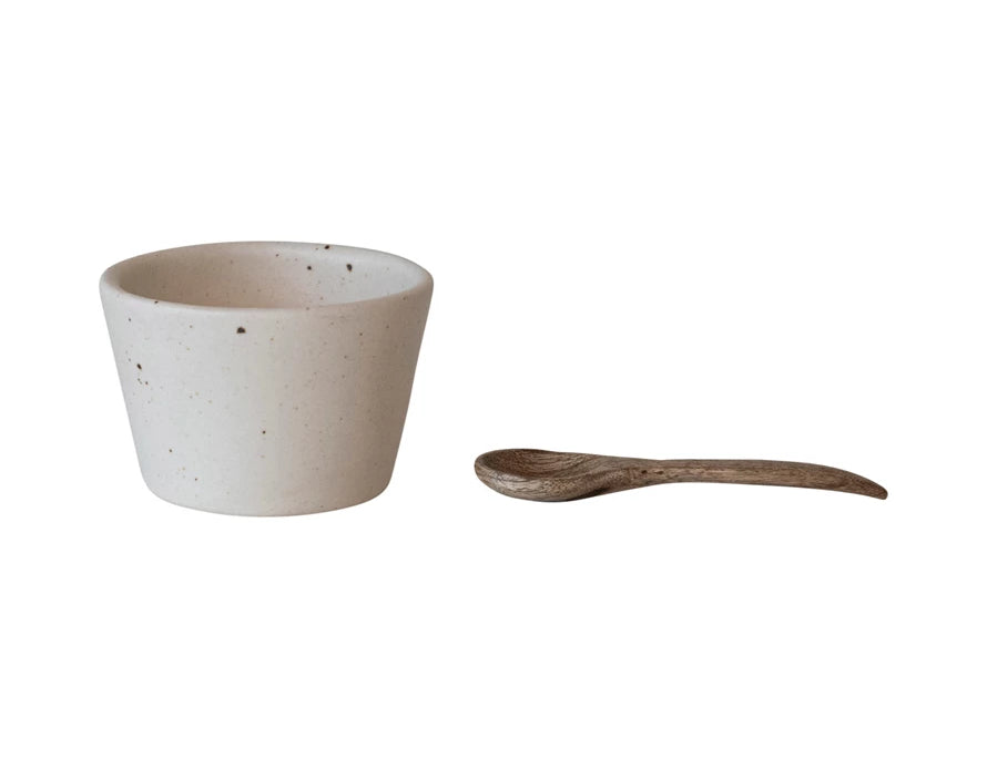 Creative Co-Op Stoneware Bowl with Mango Wood Spoon, a speckled cream bowl and a small wooden spoon