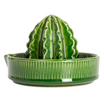 Creative Co-Op Stoneware Cactus Shaped Juicer, a glossy green cactus reamer on a ribbed dish