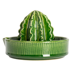 Creative Co-Op Stoneware Cactus Shaped Juicer, a glossy green cactus reamer on a ribbed dish
