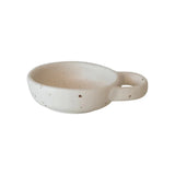 Creative Co-Op Stoneware Dish with Handle, a small speckled cream dish with a loop handle