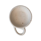 Creative Co-Op Stoneware Dish with Handle, speckled cream dish seen from above