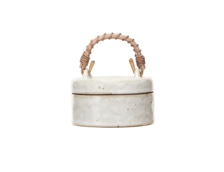 Creative Co-Op Stoneware Jar with Woven Rattan Handle, a speckled cream lidded jar