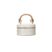 Creative Co-Op Stoneware Jar with Woven Rattan Handle, a speckled cream lidded jar