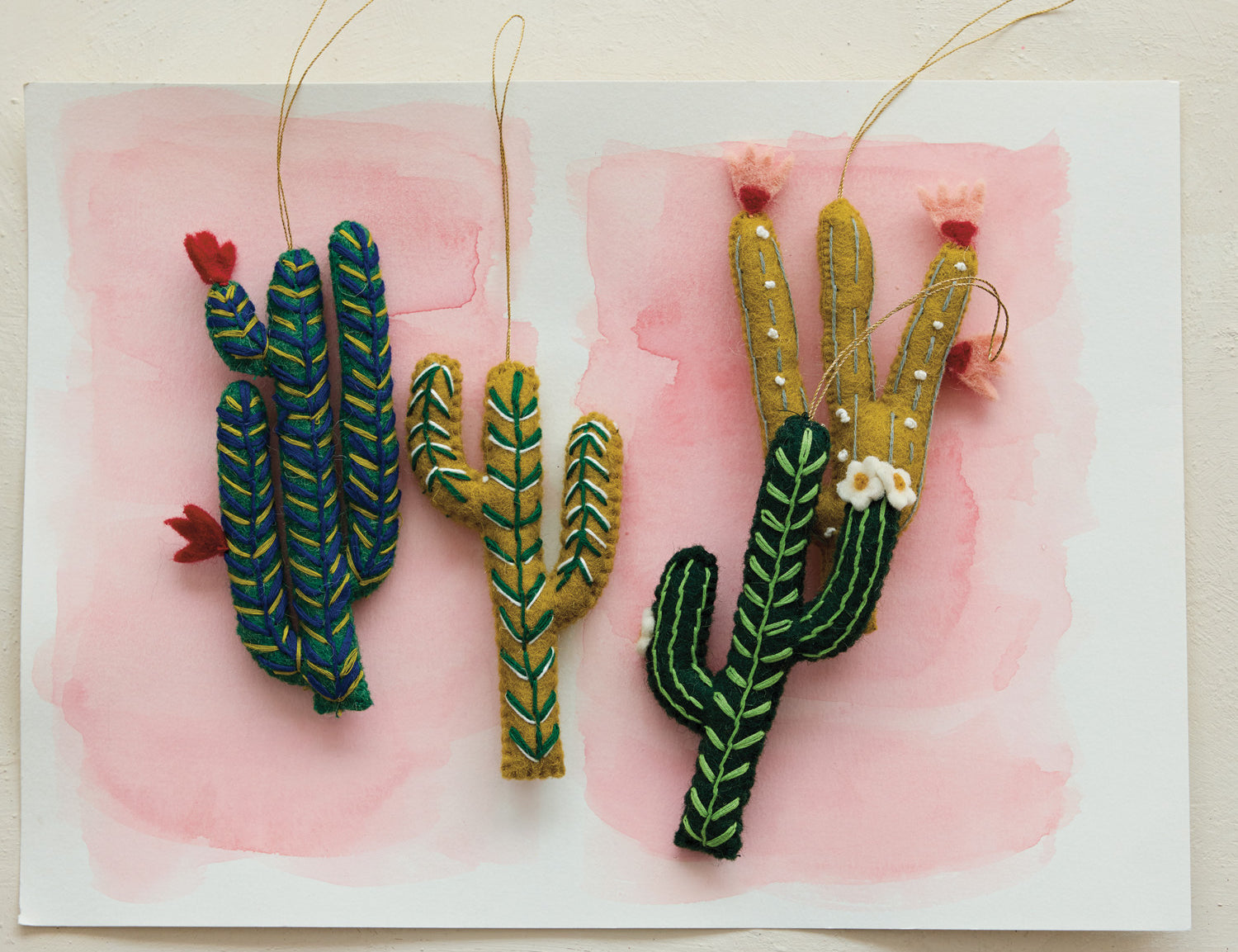 Wool felt cactus ornaments styled on a tree