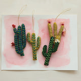 Wool felt cactus ornaments styled on a tree