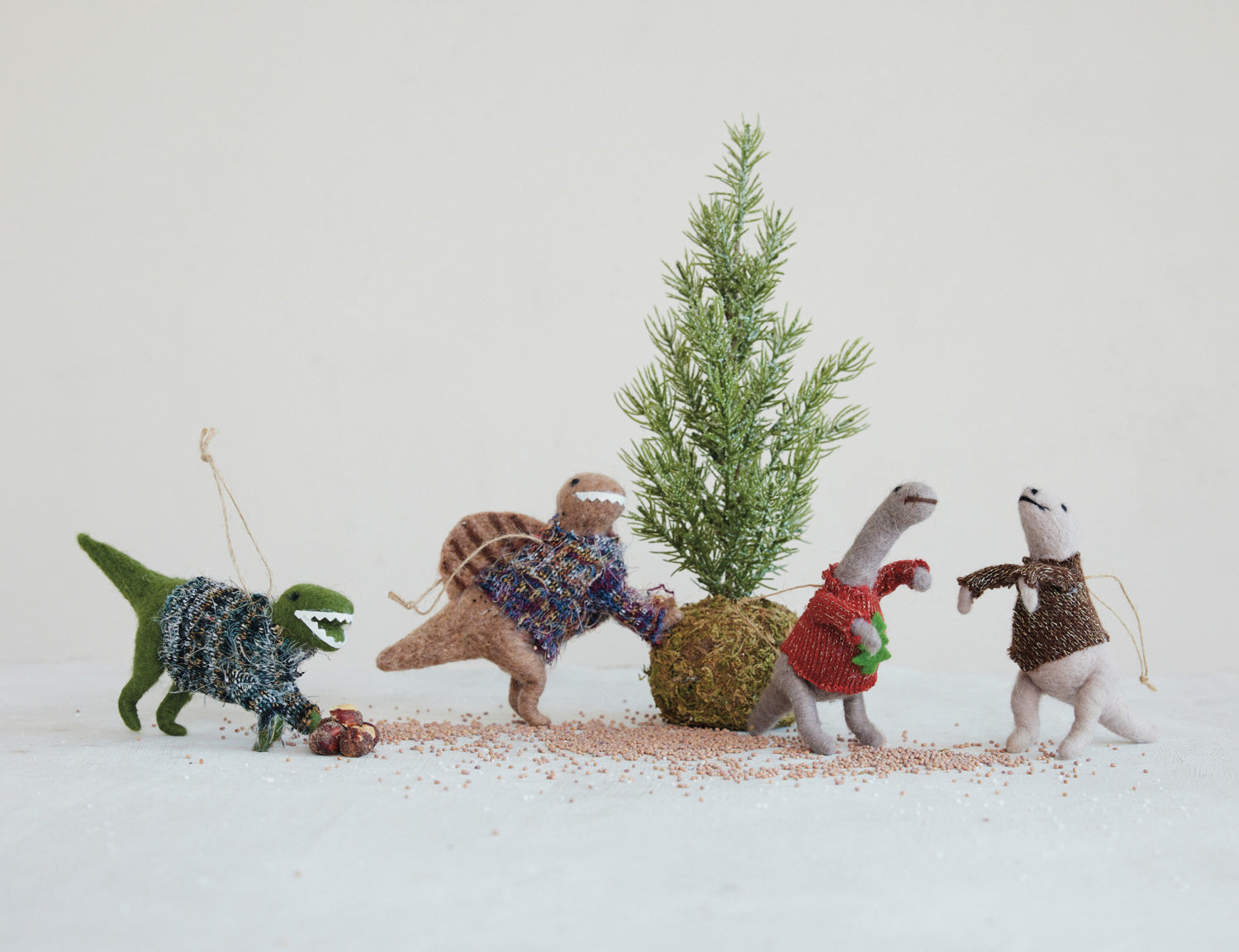 Wool felt dinosaur ornament in a knit sweater, detail