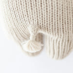 Cuddle & Kind Baby Hippo, close-up of the cream knit texture and small tail
