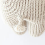 Cuddle & Kind Baby Hippo, close-up of the cream knit texture and small tail