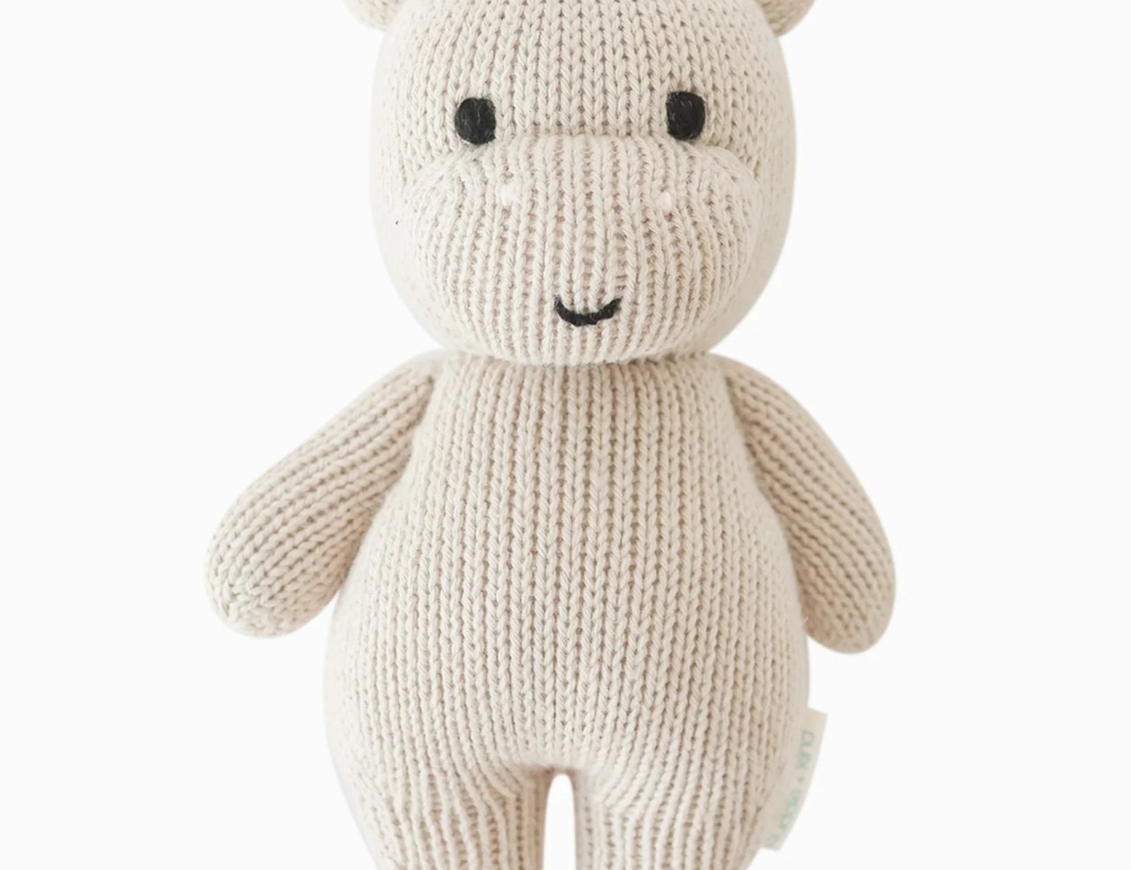 Cuddle & Kind Baby Hippo, cream hand-knit cotton hippo doll with pink ears, front view