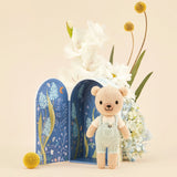 Cuddle + Kind Tiny Charlie the Honey Bear standing in its open blue floral gift box