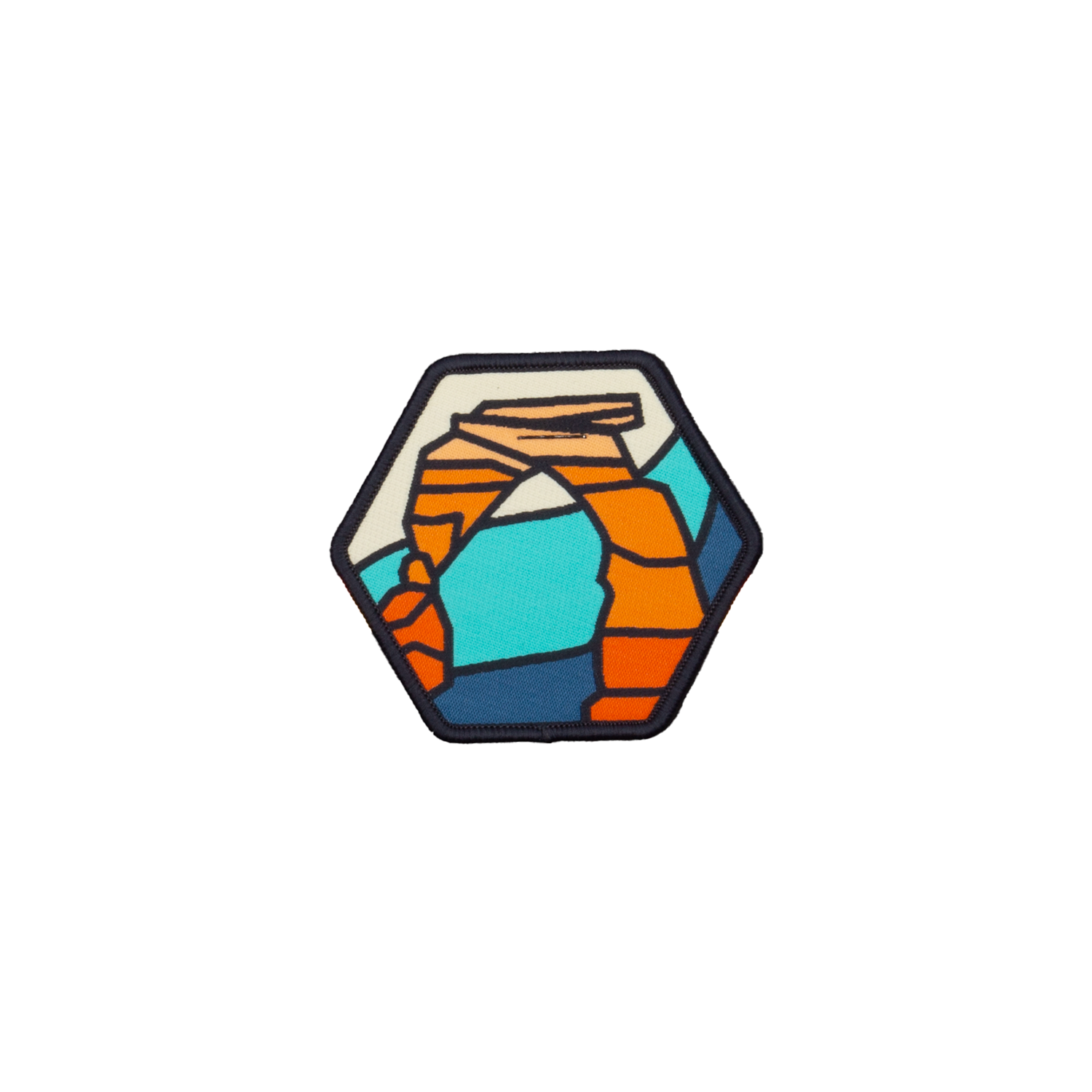 Delicate Arch woven patch, a hexagon showing the arch in orange, teal, cream and navy with a navy merrowed border.