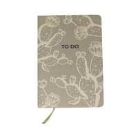 Desert Intentions hardcover to do notebook, a soft sage cover with a cream prickly pear cactus print and TO DO printed in navy, with an olive ribbon marker, on a white background.