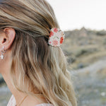 Close up of the Desert Sol Petal Claw Clip in Brushed Sand Floral holding a half up hairstyle