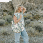 Model with the Desert Sol Carryall Tote in Cactus Bloom over her shoulder