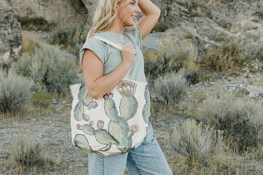 Model with the Desert Sol Carryall Tote in Cactus Bloom over her shoulder