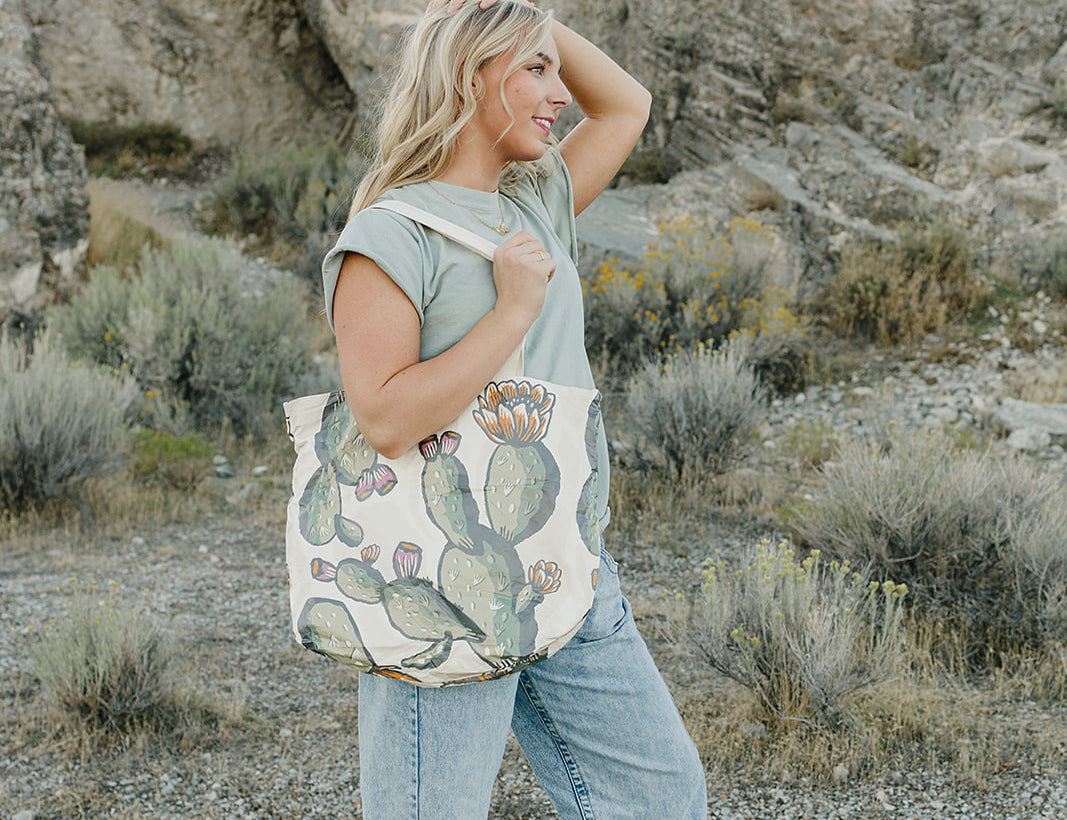 Model with the Desert Sol Carryall Tote in Cactus Bloom over her shoulder