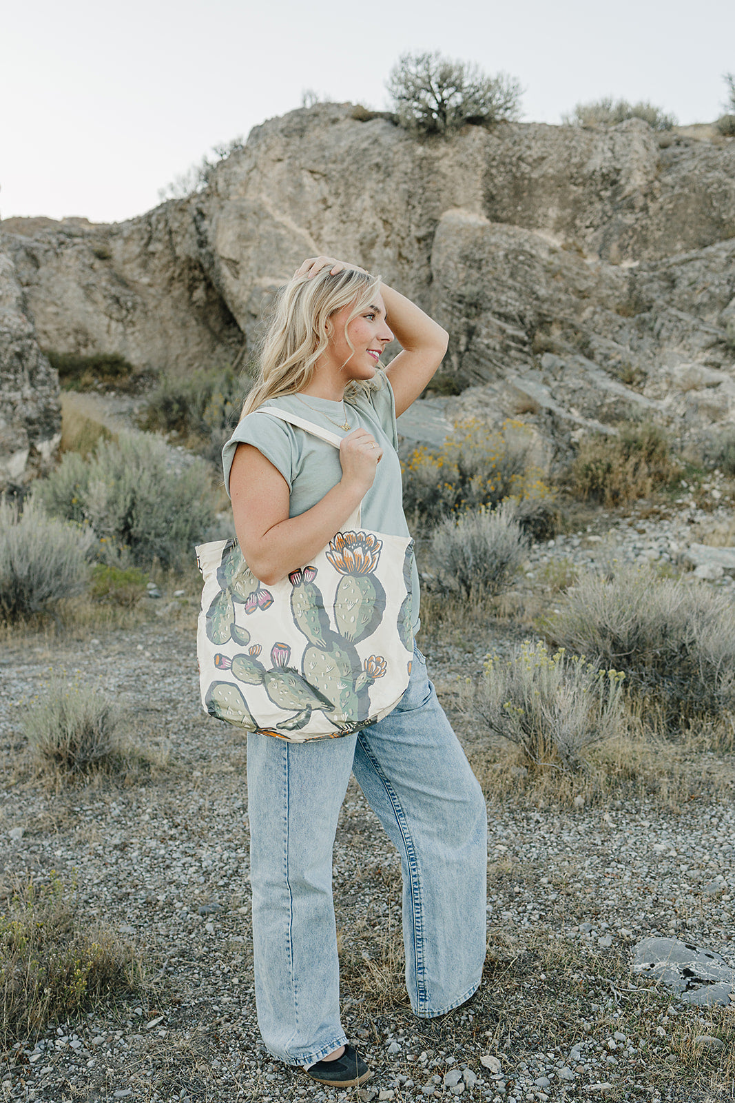 Model with the Desert Sol Carryall Tote in Cactus Bloom over her shoulder