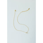 Desert Sol Dune Necklace in gold, a delicate everyday necklace, on a white background