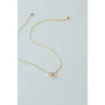 Desert Sol Dune Necklace in gold, a delicate everyday necklace, on a white background