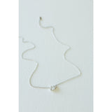 Desert Sol Dune Necklace in silver, a delicate everyday necklace, on a white background
