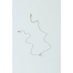 Desert Sol Dune Necklace in silver, a delicate everyday necklace, on a white background