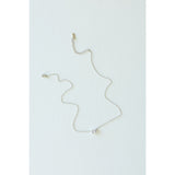 Desert Sol Dune Necklace in silver, a delicate everyday necklace, on a white background
