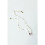 Desert Sol Ember Butterfly Necklace in lavender prism, a faceted crystal butterfly pendant on a warm gold chain, on a white background