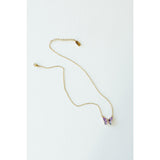 Desert Sol Ember Butterfly Necklace in lavender prism, a faceted crystal butterfly pendant on a warm gold chain, on a white background