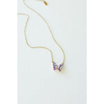 Desert Sol Ember Butterfly Necklace in lavender prism, a faceted crystal butterfly pendant on a warm gold chain, on a white background