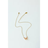 Desert Sol Ember Butterfly Necklace in peach, a faceted crystal butterfly pendant on a warm gold chain, on a white background