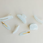 Desert Sol Moonstone acrylic hair clip set with an oval lay flat claw clip, classic claw clip, petal claw clip and snap clips in soft speckled blue