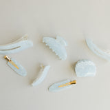 Desert Sol Moonstone acrylic hair clip set with an oval lay flat claw clip, classic claw clip, petal claw clip and snap clips in soft speckled blue