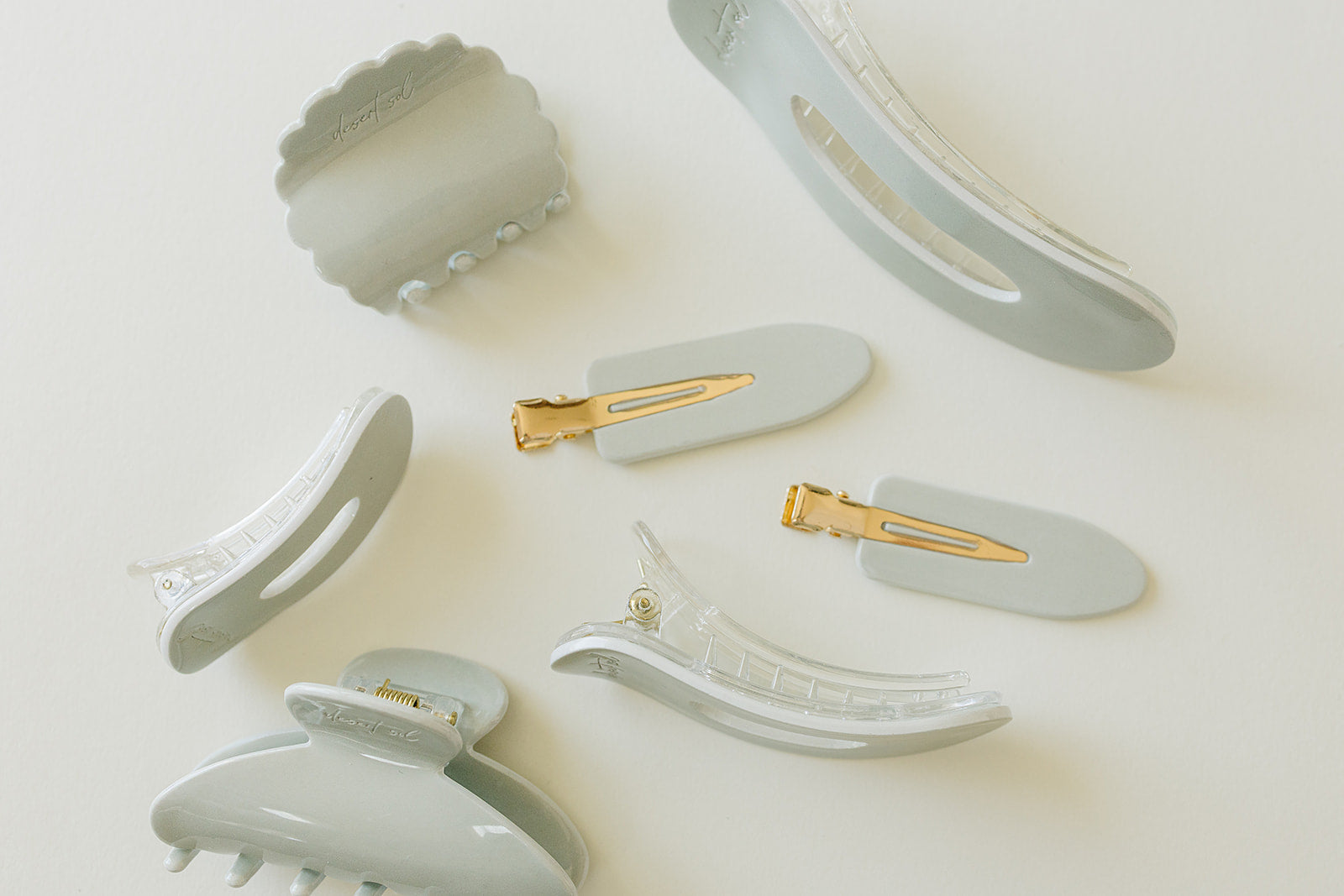 Desert Sol Muted Moss acrylic hair clip set with an oval lay flat claw clip, classic claw clip, petal claw clip and snap clips in soft gray green