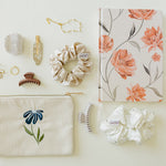 Desert Sol Night Bloom corduroy pouch with an Apricot Floral notebook, scrunchies, claw clips and gold jewelry