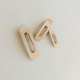 Desert Sol Oval Lay Flat Matte Claw Clip in beige, shown in Mini, Standard and Classic sizes