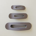 Desert Sol Oval Lay Flat Matte Claw Clip in Grey Lilac, shown in Mini, Standard and Classic sizes