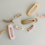 Desert Sol Oval Lay Flat Matte Claw Clips in beige, light pink and light brown with other hair accessories