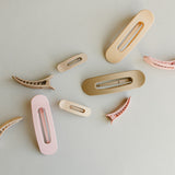 Desert Sol Oval Lay Flat Matte Claw Clips in beige, light pink and light brown with other hair accessories