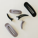 Desert Sol Oval Lay Flat Matte Claw Clips in Grey Lilac and Black with other hair accessories