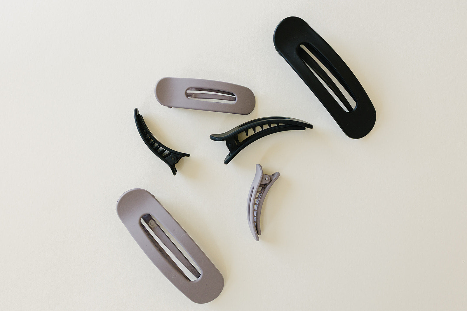 Desert Sol Oval Lay Flat Matte Claw Clips in Grey Lilac and Black with other hair accessories