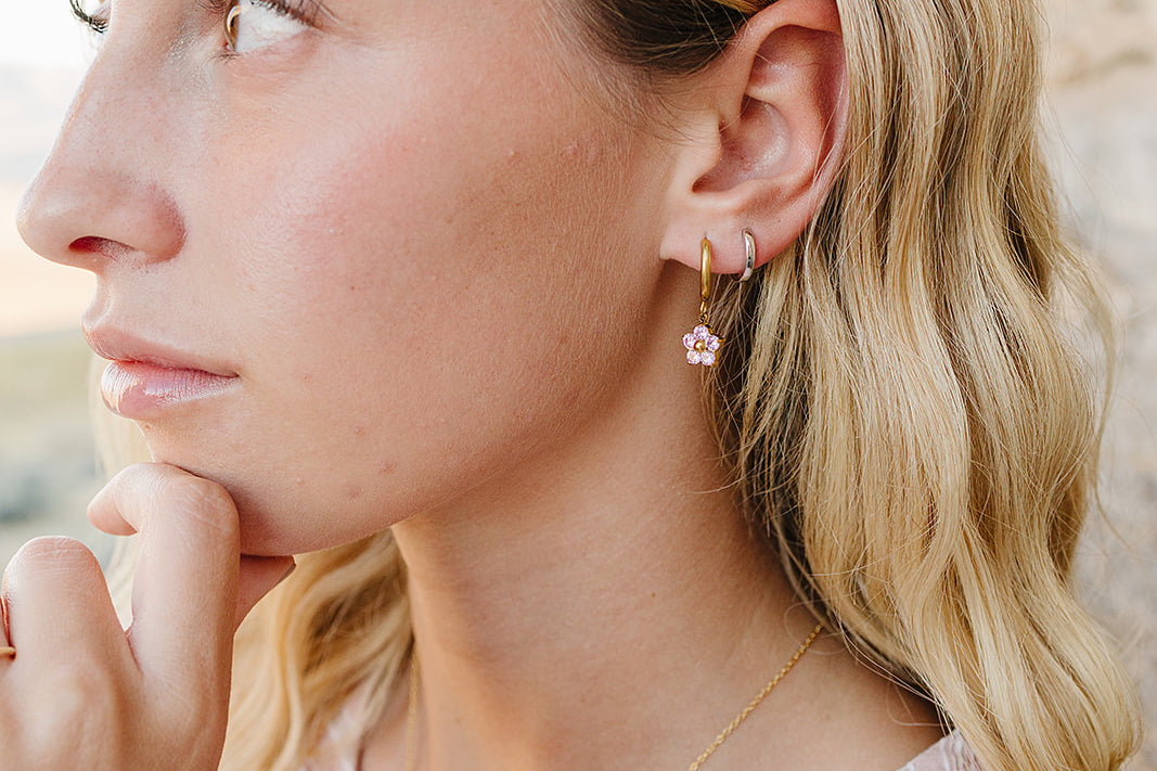 Profile close up of the Desert Sol Petal Hoop Earrings in pink