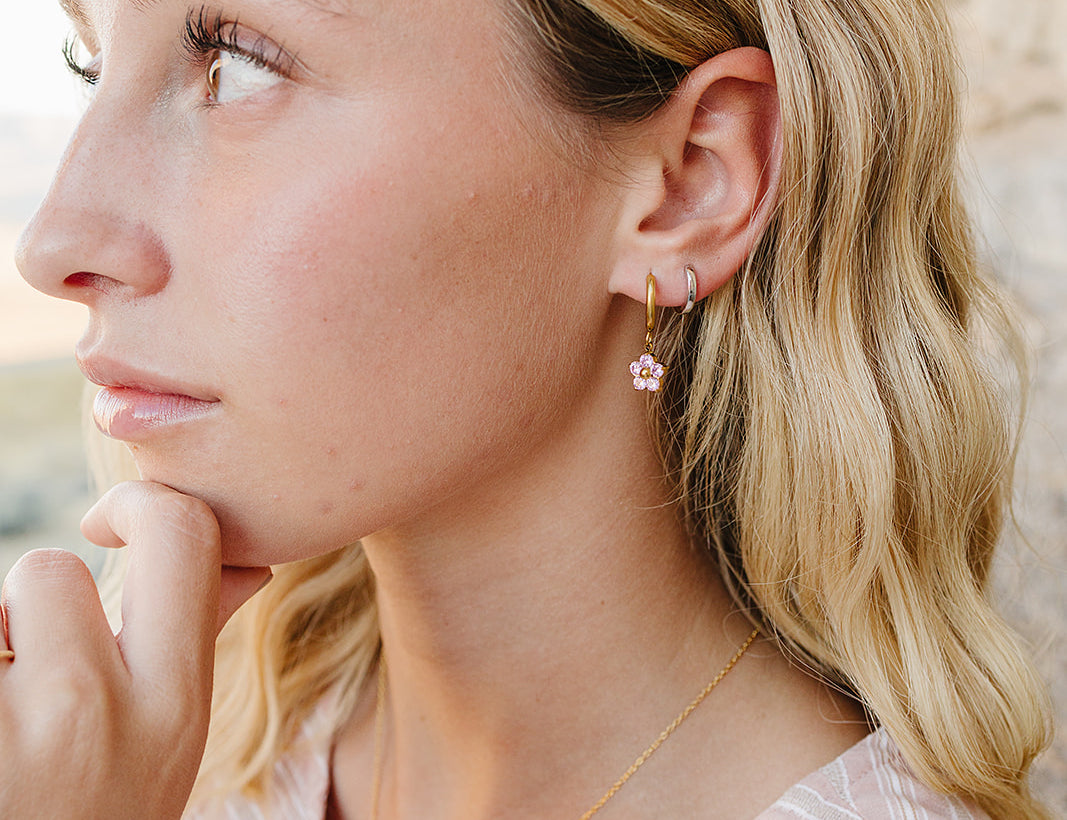 Profile close up of the Desert Sol Petal Hoop Earrings in pink