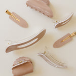Desert Sol Rose Dust acrylic hair clip set with an oval lay flat claw clip, classic claw clip, petal claw clip and snap clips in dusty pink