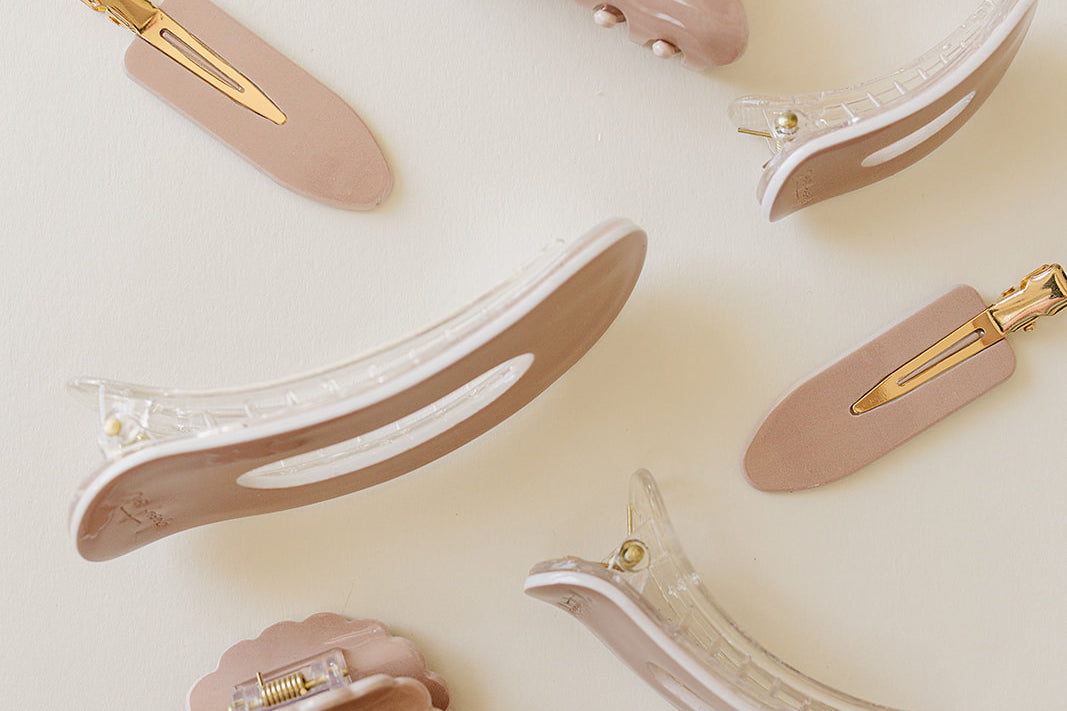 Desert Sol Rose Dust acrylic hair clip set with an oval lay flat claw clip, classic claw clip, petal claw clip and snap clips in dusty pink