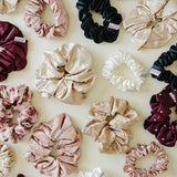 Desert Sol silk and satin scrunchies in plum, black, champagne, ivory and floral prints