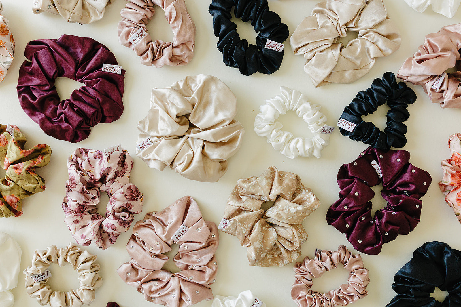 Desert Sol silk and satin scrunchies in plum, black, champagne, ivory and floral prints