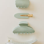 Desert Sol Soft Sage acrylic hair clip set with an oval lay flat claw clip, classic claw clip, petal claw clip and snap clips in pale mint