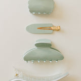 Desert Sol Soft Sage acrylic hair clip set with an oval lay flat claw clip, classic claw clip, petal claw clip and snap clips in pale mint