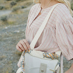 Inside the Desert Sol Utility Tote in Cactus Bloom, showing the interior pocket and snap closure